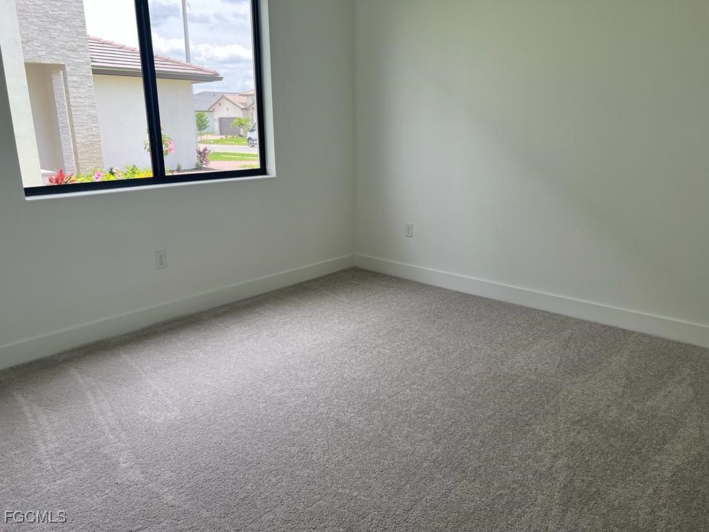 5101 Isidora Lane Ave Maria, FL 34142 - Photo 21 of 33 an empty room with a window