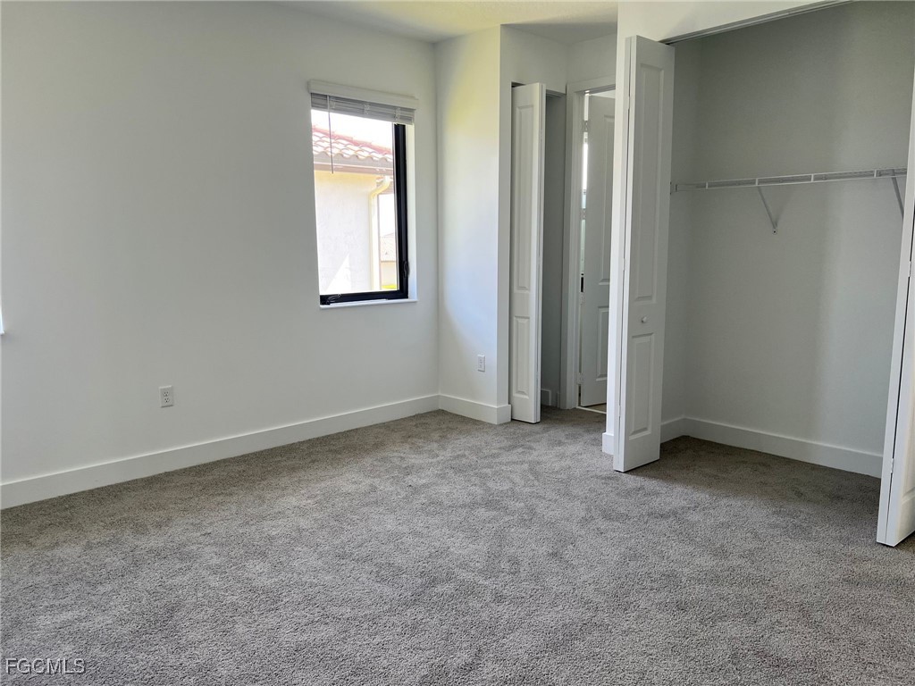 5101 Isidora Lane Ave Maria, FL 34142 - Photo 25 of 33 an empty room with windows