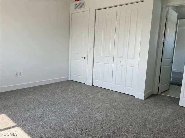 a living room with furniture window and wooden floor