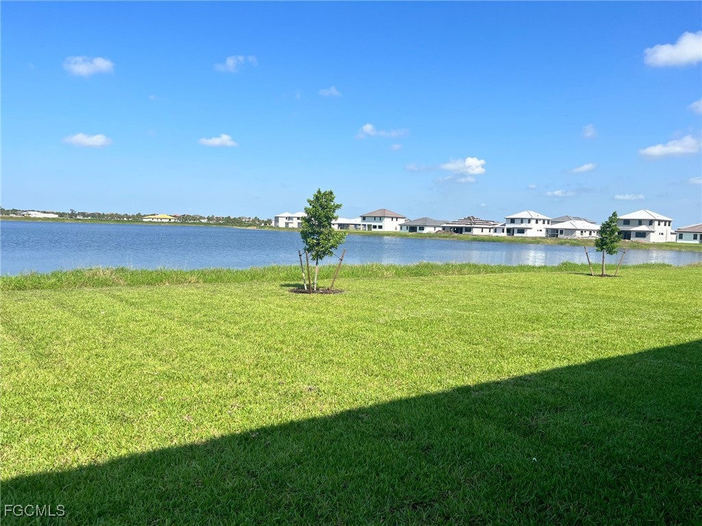 5101 Isidora Lane Ave Maria, FL 34142 - Photo 4 of 33 a view of a lake with houses