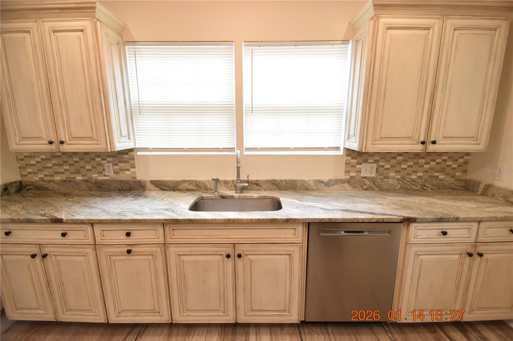 907 East Patterson Street Tampa, FL 33604 - Photo 13 of 35 a kitchen with a sink cabinets and window