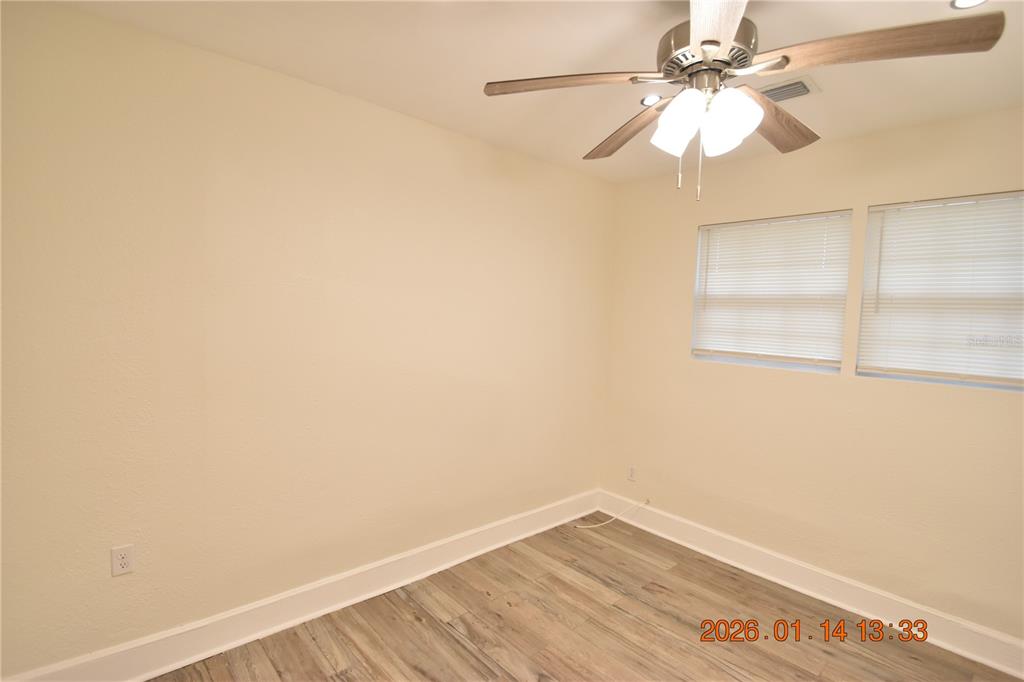 907 East Patterson Street Tampa, FL 33604 - Photo 19 of 35 an empty room with a window and a fan