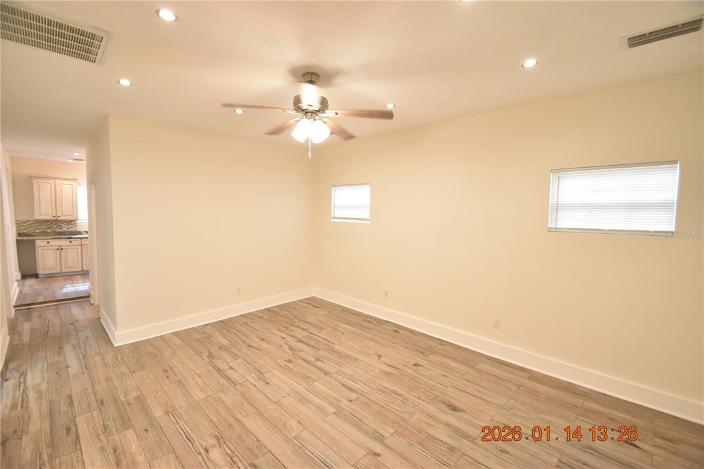 907 East Patterson Street Tampa, FL 33604 - Photo 2 of 35 wooden floor in an empty room with a window