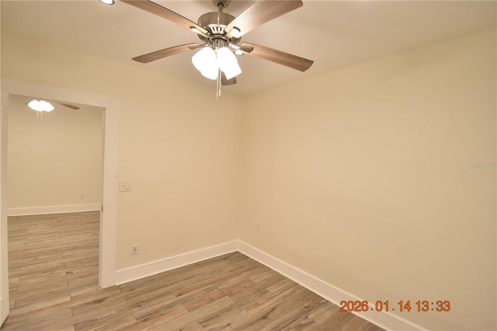 907 East Patterson Street Tampa, FL 33604 - Photo 21 of 35 a view of an empty room with wooden floor