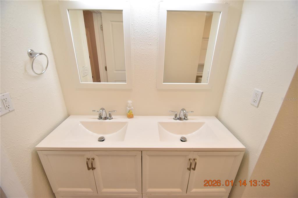 907 East Patterson Street Tampa, FL 33604 - Photo 27 of 35 a bathroom with a sink and a mirror