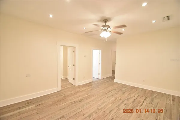 a view of an empty room with a window