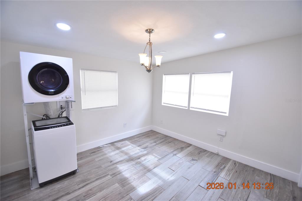 907 East Patterson Street Tampa, FL 33604 - Photo 6 of 35 a view of a room with wooden floor and windows