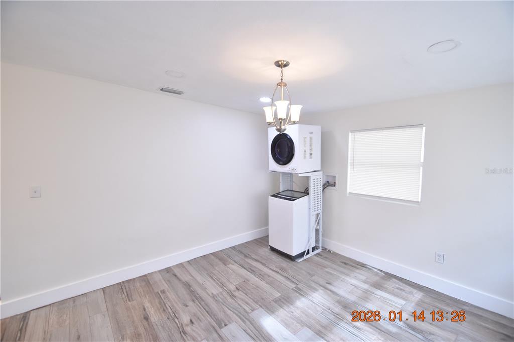 907 East Patterson Street Tampa, FL 33604 - Photo 7 of 35 a view of a room with wooden floor and fireplace