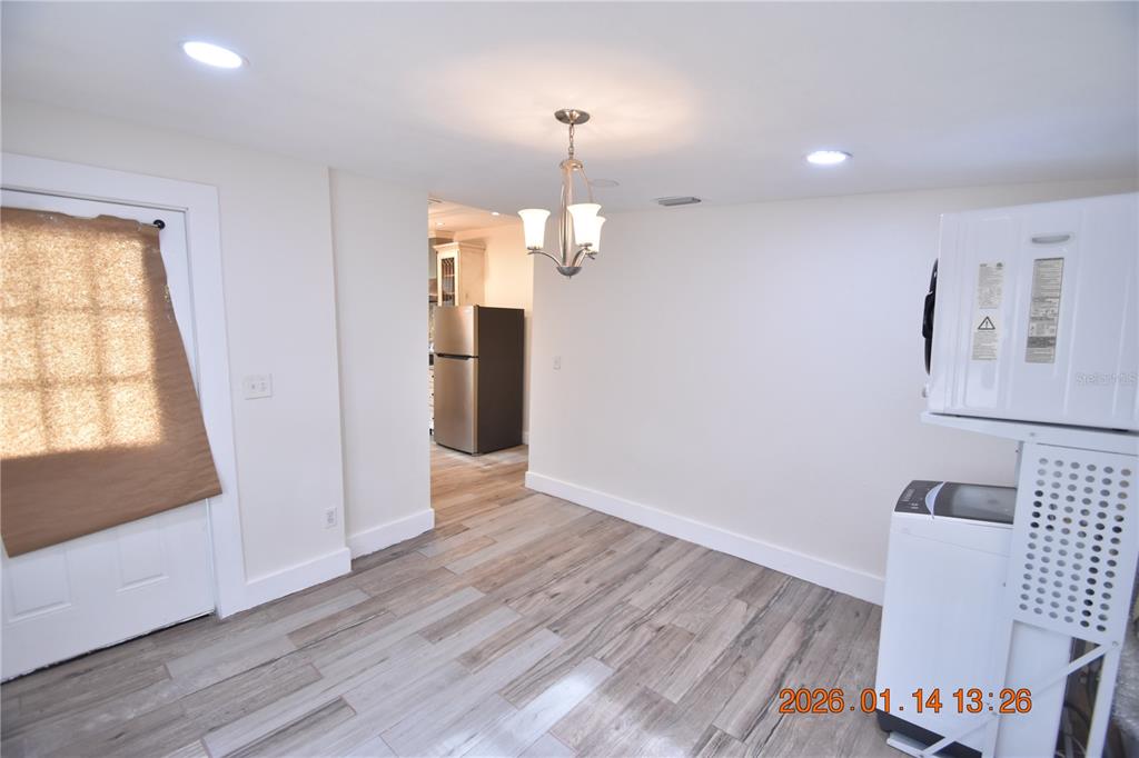 907 East Patterson Street Tampa, FL 33604 - Photo 8 of 35 a view of a room with wooden floor staircase and a living room