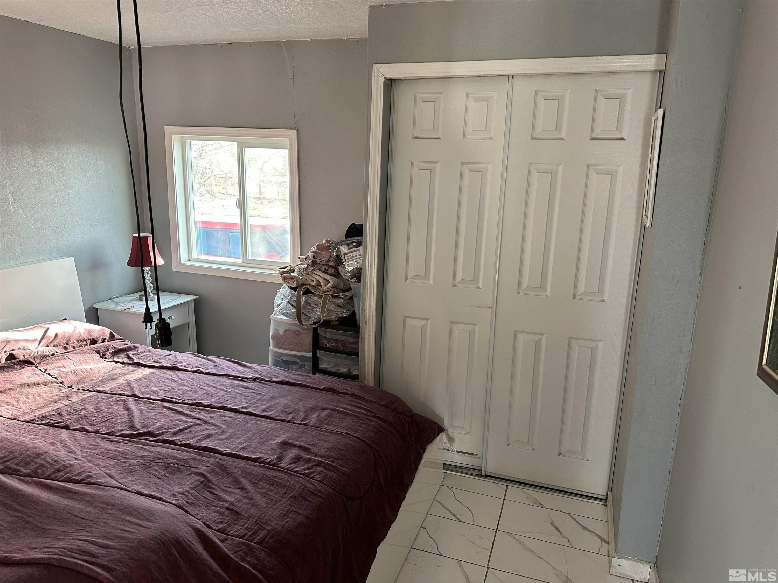 7060 Highway 50 Dayton, NV 89403 - Photo 37 of 40 a bedroom with a bed and a window