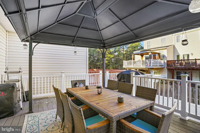 a balcony with furniture and a potted plant