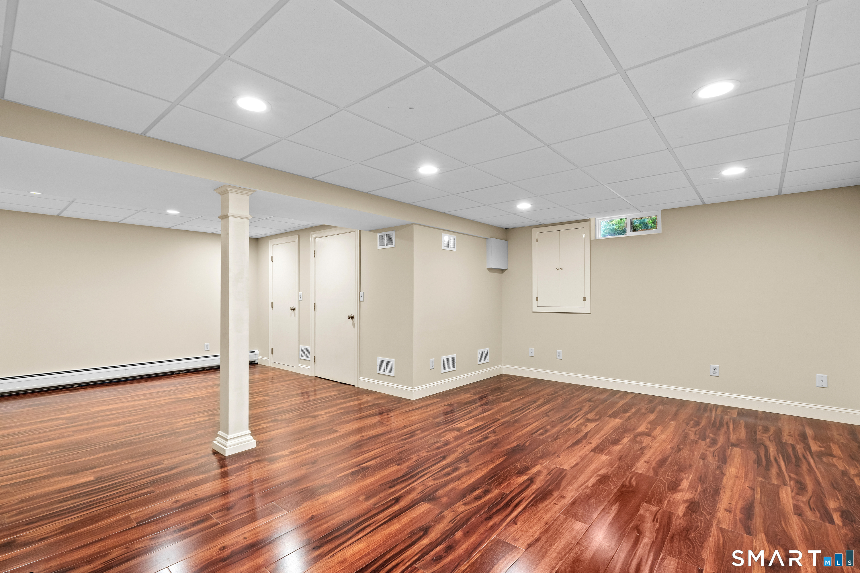 71 Quail Run Road Suffield, CT 06078 - Photo 38 of 40 Finished basement for additional living space. You will also find a cedar closet, utility room, and lots of additional space for storage