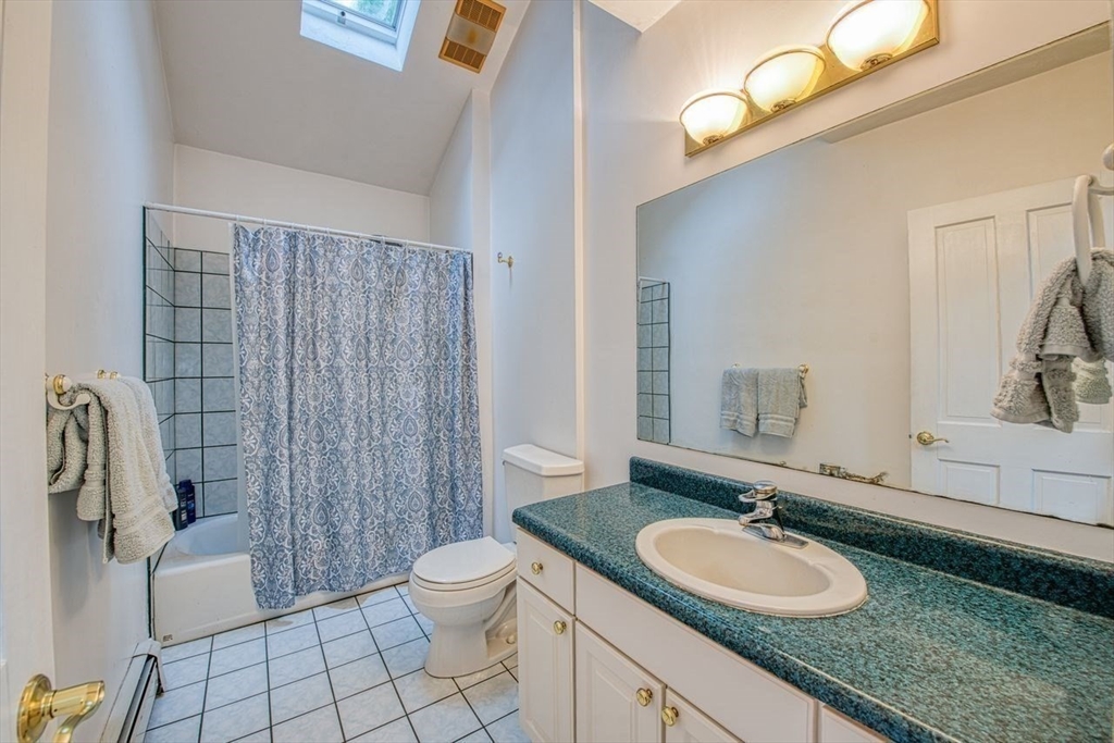 7 Tisdale Road Sharon, MA 02067 - Photo 20 of 37 a bathroom with a granite countertop sink a toilet a mirror and shower