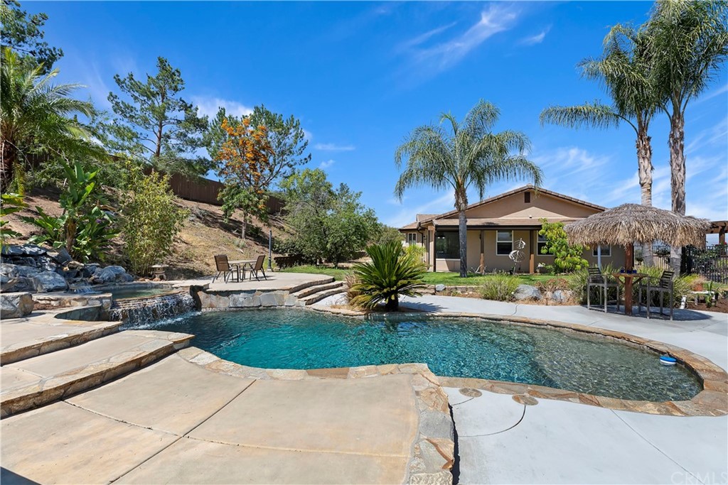 33425 Monte Verde Temecula, CA 92592 - Photo 50 of 68 a view of a house with swimming pool and sitting area