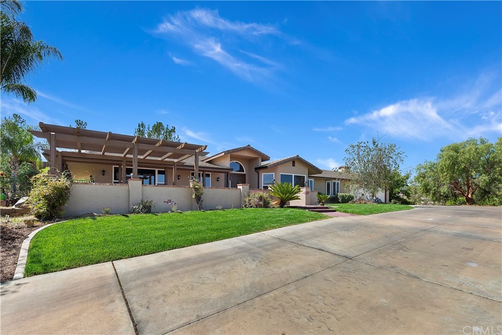 33425 Monte Verde Temecula, CA 92592 - Photo 10 of 68 a view of a big house with a big yard and palm trees