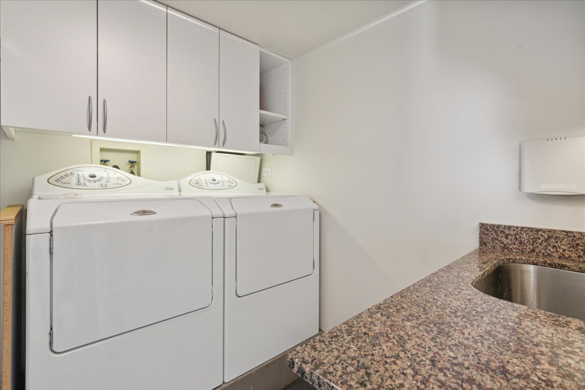 1618 Sheridan Road, Unit PH Wilmette, IL 60091 - Photo 39 of 49 a utility room with dryer and washer
