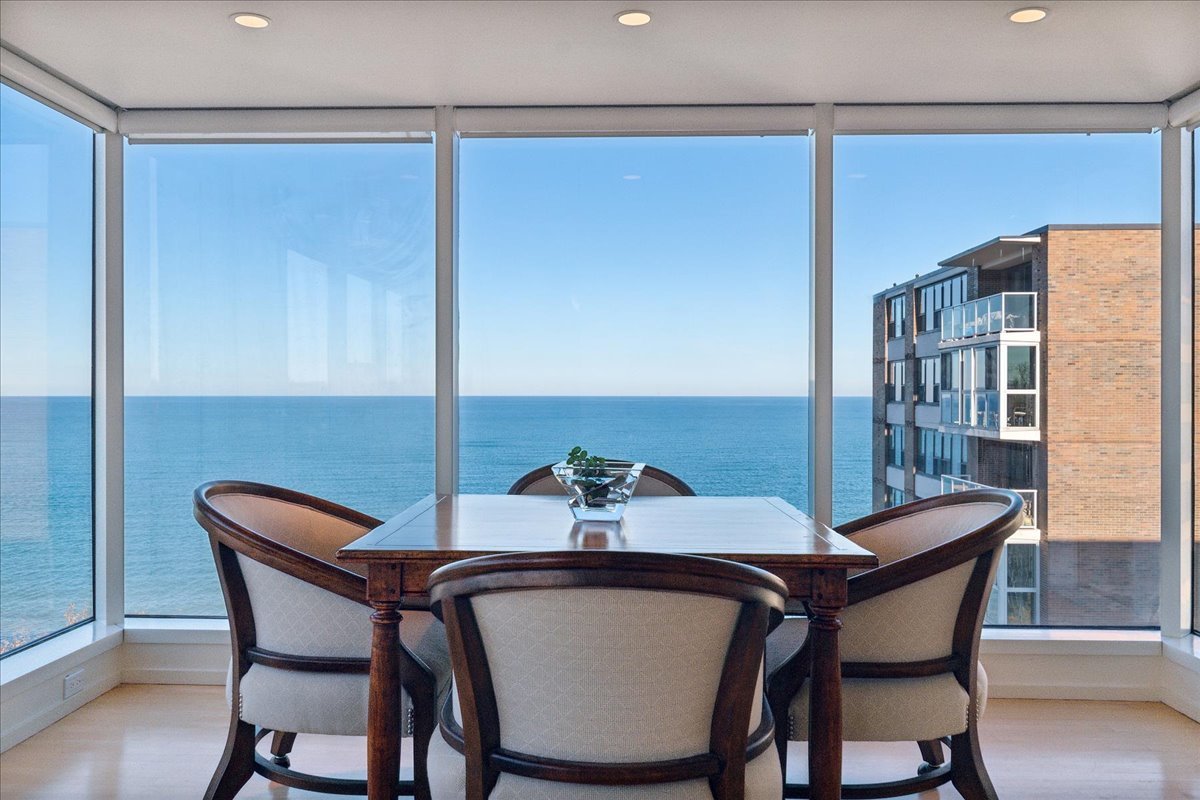 1618 Sheridan Road, Unit PH Wilmette, IL 60091 - Photo 7 of 49 a dining room with furniture and window