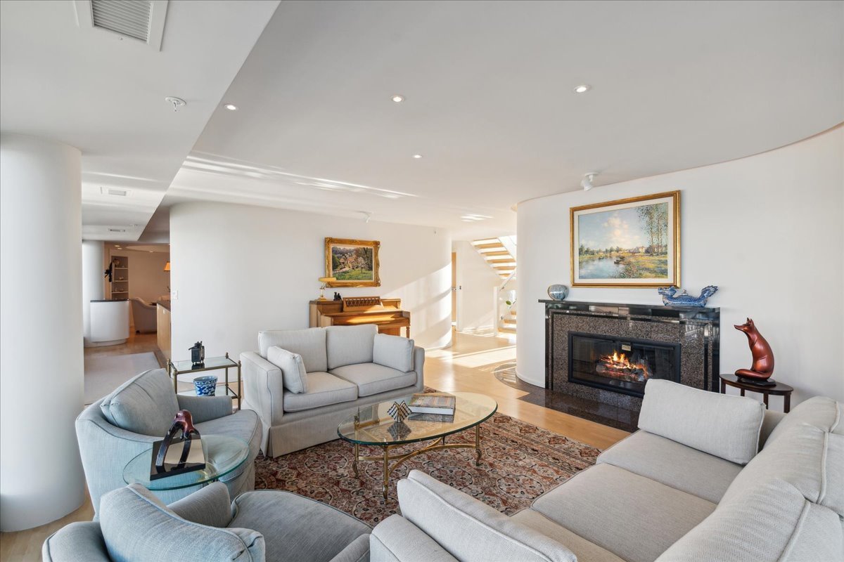 1618 Sheridan Road, Unit PH Wilmette, IL 60091 - Photo 8 of 49 a living room with furniture and a fireplace