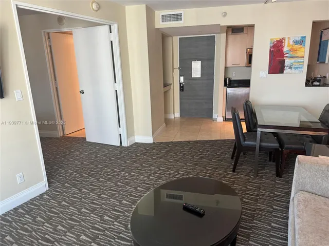 a living room with furniture and a rug