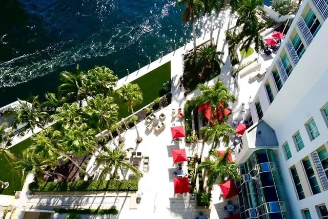 a view of swimming pool with a table and chairs