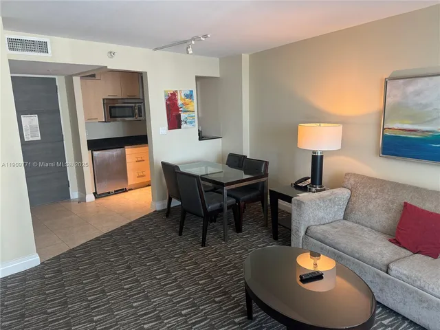 a living room with furniture and a table