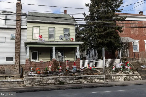 a front view of a house with street