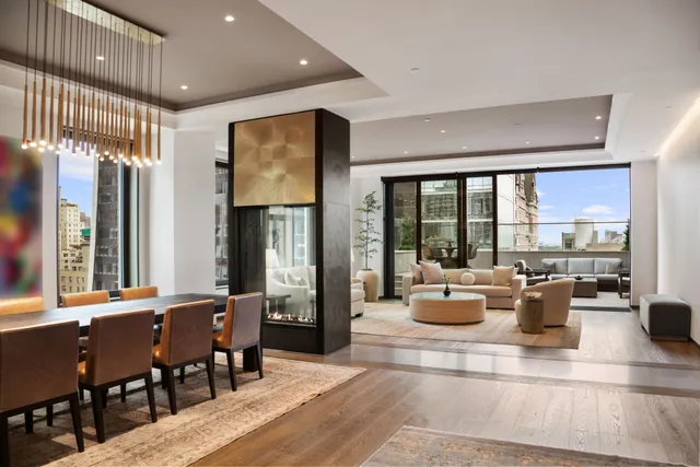 a view of swimming pool with outdoor seating and city view