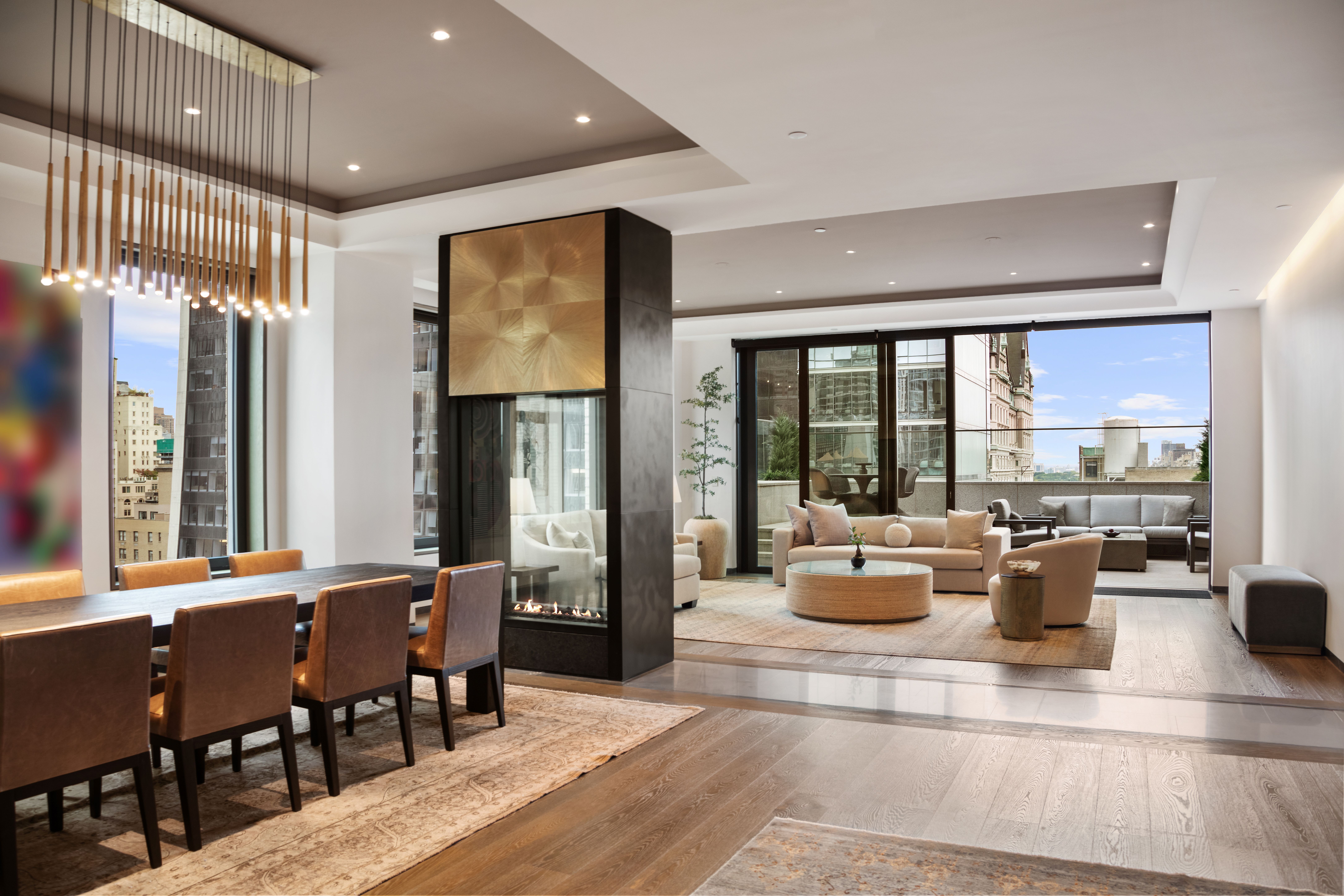 730 5th Avenue, Unit 18B Manhattan, NY 10019 - Photo 4 of 10 a view of a dining room with furniture window and outside view