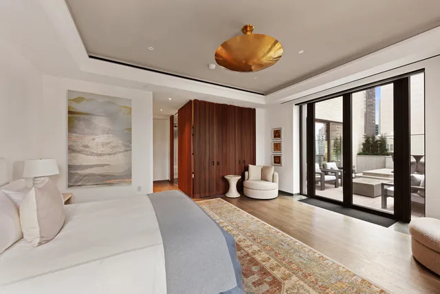 a kitchen with stainless steel appliances kitchen island granite countertop a refrigerator and a stove top oven