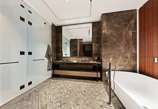 a spacious bedroom with a large bed and a large window