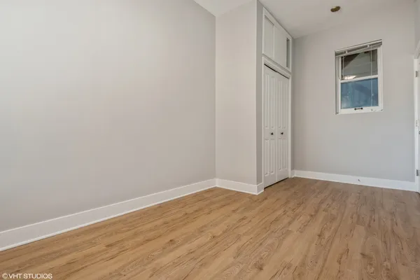 a bathroom with a sink vanity and shower