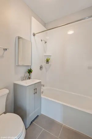 a city street lined with buildings and cars