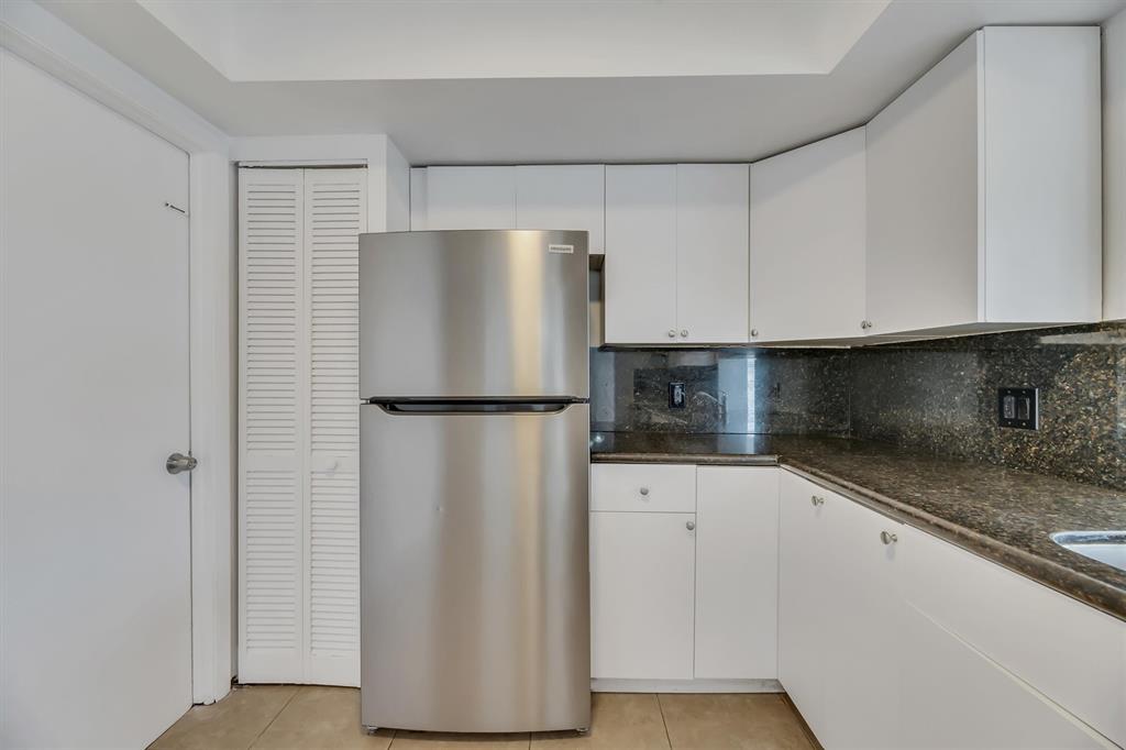 180 Southwest 78th Avenue Margate, FL 33068 - Photo 16 of 40 a kitchen with stainless steel appliances granite countertop a refrigerator and a sink