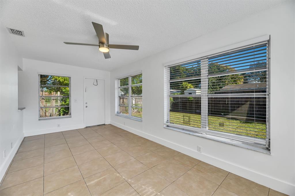 180 Southwest 78th Avenue Margate, FL 33068 - Photo 21 of 40 a view of an empty room with a window