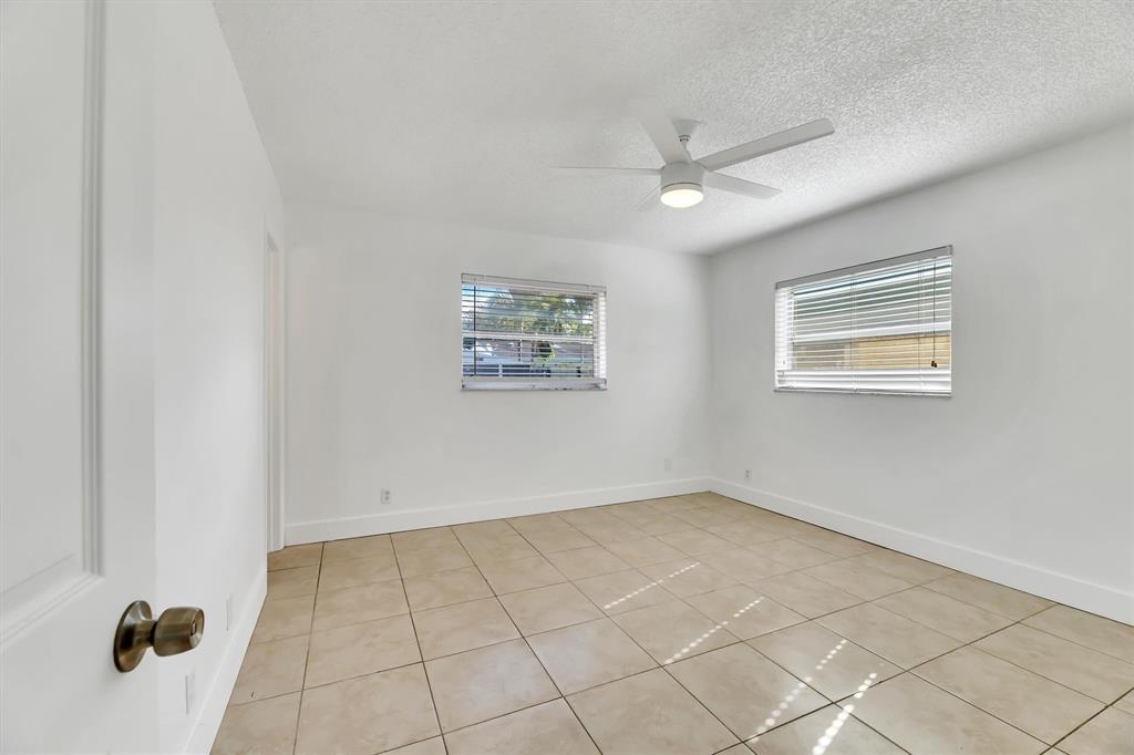 180 Southwest 78th Avenue Margate, FL 33068 - Photo 27 of 40 a view of an empty room with a window