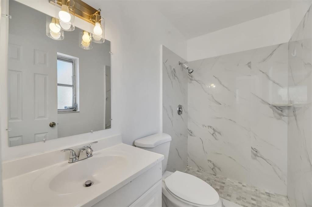 180 Southwest 78th Avenue Margate, FL 33068 - Photo 30 of 40 a bathroom with a sink toilet and shower