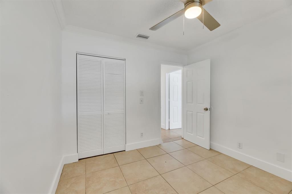 180 Southwest 78th Avenue Margate, FL 33068 - Photo 34 of 40 a view of an empty room and chandelier fan