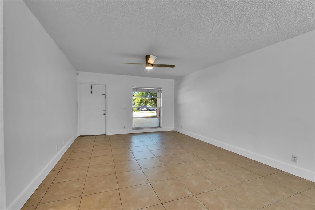 180 Southwest 78th Avenue Margate, FL 33068 - Photo 7 of 40 an empty room with windows and closet