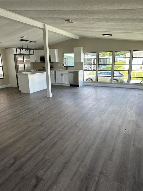 39638 Sunvalley Drive Zephyrhills, FL 33542 - Photo 5 of 14 a view of an empty room with a window and wooden floor