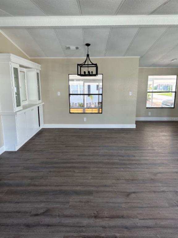 39638 Sunvalley Drive Zephyrhills, FL 33542 - Photo 6 of 14 a room with a chandelier and wooden floor