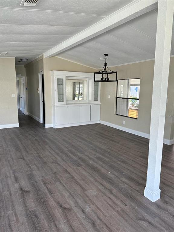 39638 Sunvalley Drive Zephyrhills, FL 33542 - Photo 7 of 14 a view of empty room with wooden floor and fan