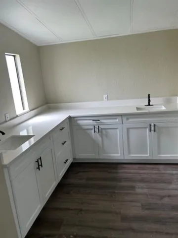 a room with sink and mirror