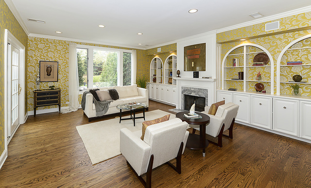 227 Raleigh Road Kenilworth, IL 60043 - Photo 14 of 40 a living room with furniture fireplace and flat screen tv