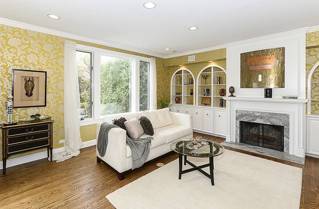 227 Raleigh Road Kenilworth, IL 60043 - Photo 15 of 40 a living room with furniture and a fireplace