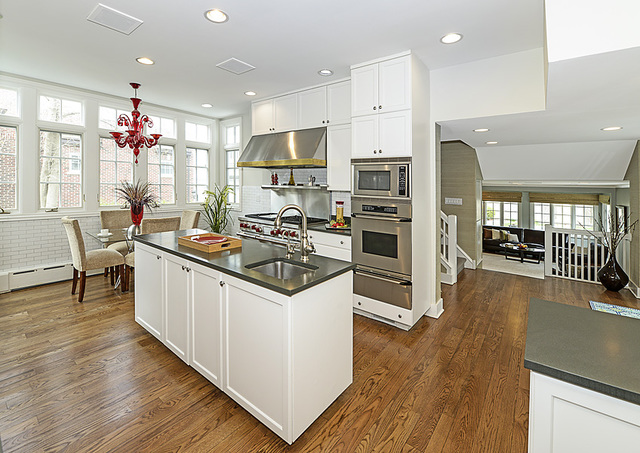 227 Raleigh Road Kenilworth, IL 60043 - Photo 16 of 40 a kitchen that has a lot of cabinets a sink and appliances