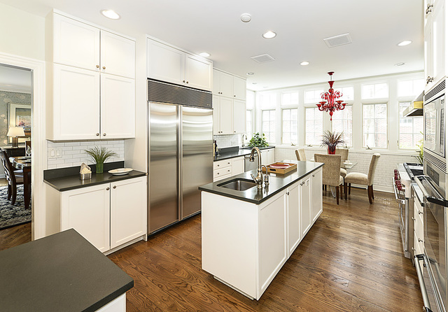 227 Raleigh Road Kenilworth, IL 60043 - Photo 19 of 40 a kitchen that has a lot of cabinets a sink and appliances