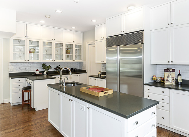 227 Raleigh Road Kenilworth, IL 60043 - Photo 20 of 40 a kitchen with stainless steel appliances granite countertop a sink a stove and a refrigerator