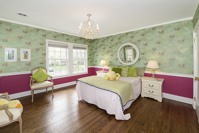 227 Raleigh Road Kenilworth, IL 60043 - Photo 29 of 40 a bedroom with a bed and a dresser next to a window