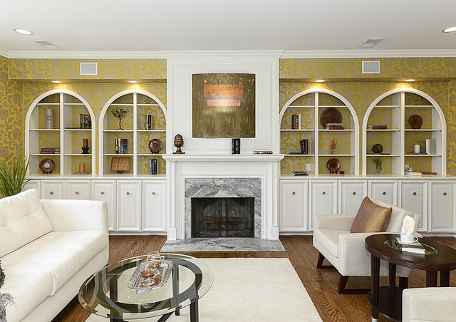 227 Raleigh Road Kenilworth, IL 60043 - Photo 6 of 40 a living room with couches painted walls and a fireplace