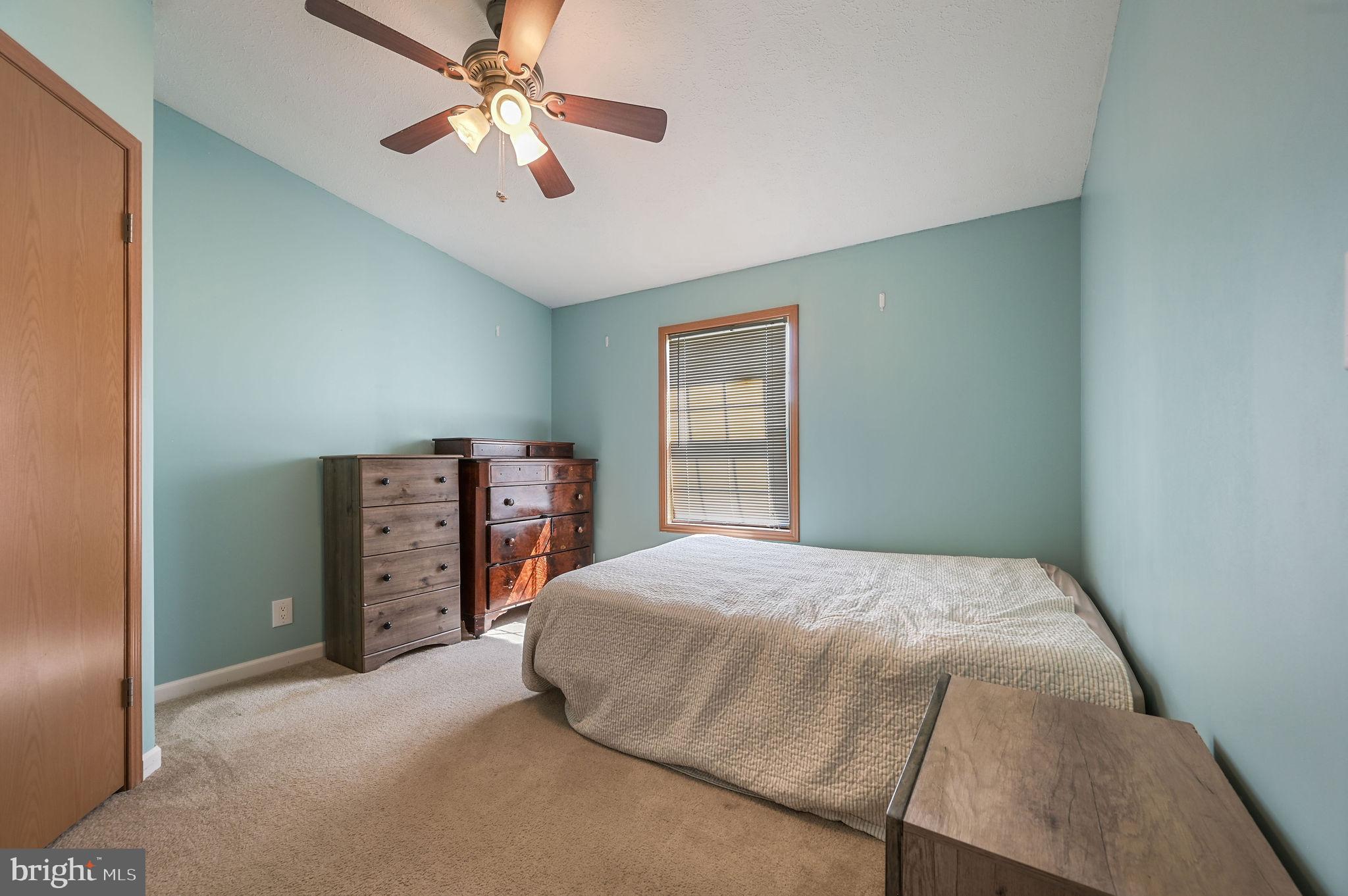 3992 Midstate Road Felton, DE 19943 - Photo 17 of 21 a bedroom with a bed and a closet